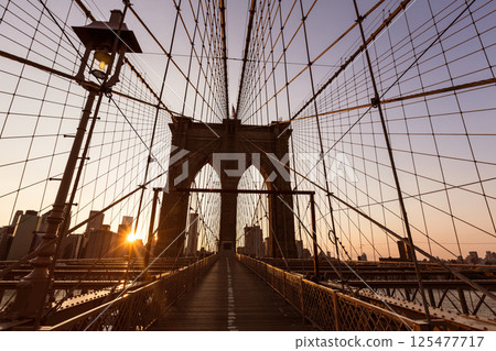 Brooklyn Bridge sunset with Manhattan skyline US 125477717