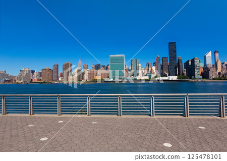 Manhattan New York sunny skyline East River NYC Manhattan New York sunny skyline East River NYC 125478101