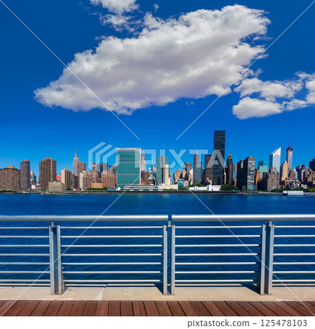 Manhattan New York sunny skyline East River NYC Manhattan New York sunny skyline East River NYC 125478103