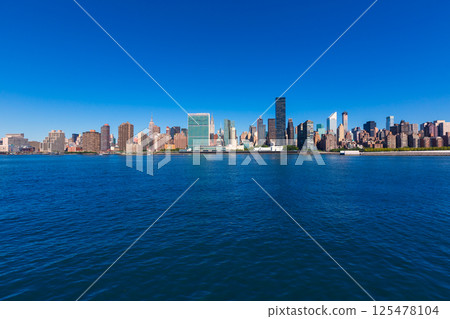 Manhattan New York sunny skyline East River NYC 125478104
