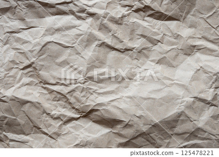Paper texture background of brown crumpled recycled cardboard paper sheet 125478221