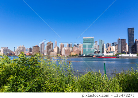 Manhattan New York sunny skyline East River NYC Manhattan New York sunny skyline East River NYC 125478275
