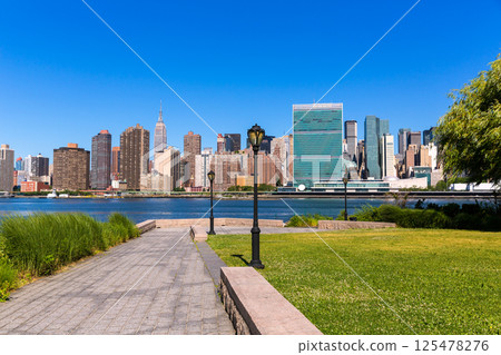 Manhattan New York sunny skyline East River NYC Manhattan New York sunny skyline East River NYC 125478276