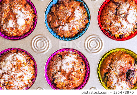 Delicious homemade muffins with berries, just pulled out of the oven 125478970