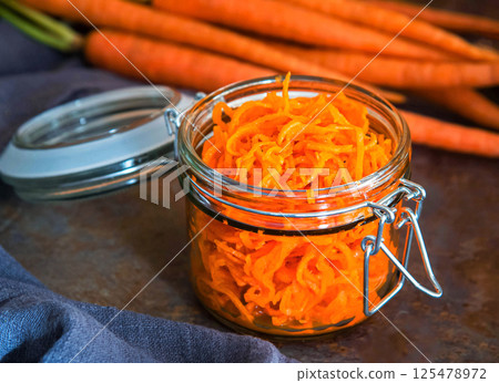 Healthy organic carrot salad in jar. Healthy organic carrot salad in jar. 125478972