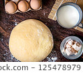 Fresh raw dough and ingredients for making dough 125478979