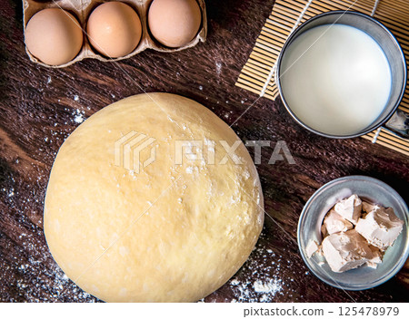 Fresh raw dough and ingredients for making dough 125478979