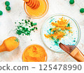 Spirulina facial mask in the small glass bowl. Natural beauty treatment. Top view 125478990