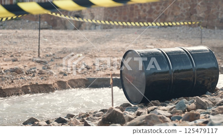 Close up of industry oil fuel tank spilling water pollution, Conserve water and Environment Issue, biohazard caution of collects sample of waste from industrial 125479117