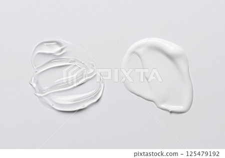 A sample of white and transparent cosmetic cream 125479192