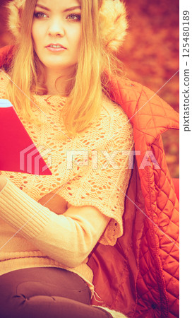 Young lady with literature. 125480189