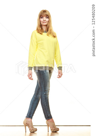 blonde fashionable woman in yellow blouse blonde fashionable woman in yellow blouse 125480209