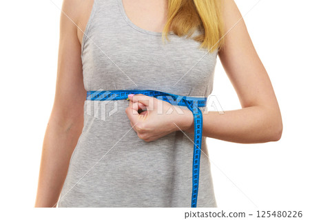 woman measuring her size under breast isolated 125480226