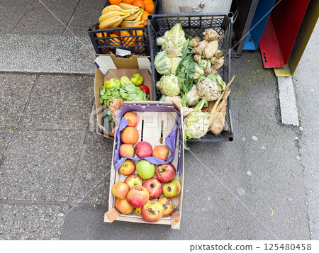 Pile of rotting kitchen fruits and vegetable scraps. Garbage waste for recycling as an environmentally responsible compost that enriches soil in a garden. 125480458