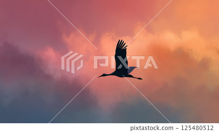 Silhouette of a huge stork soaring against a soft pastel sky 125480512
