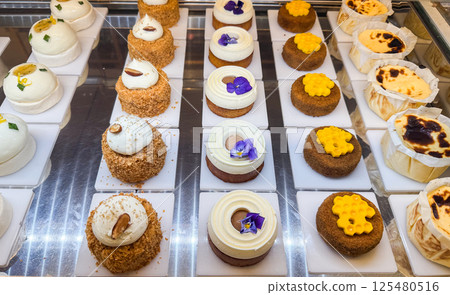 Colorful pastries with chocolate, cream and fruit toppings. Stop diet and contemporary dessert art Colorful pastries with chocolate, cream and fruit toppings. Stop diet and contemporary dessert art 125480516
