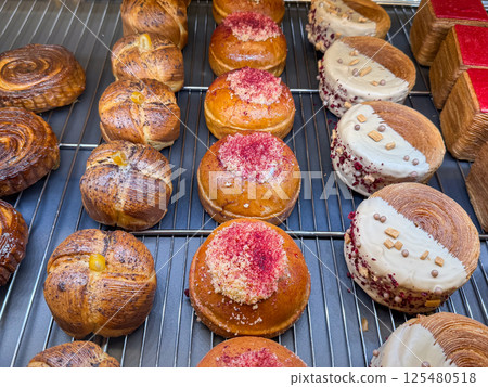 Colorful pastries with chocolate, cream and fruit toppings. Stop diet and contemporary dessert art Colorful pastries with chocolate, cream and fruit toppings. Stop diet and contemporary dessert art 125480518