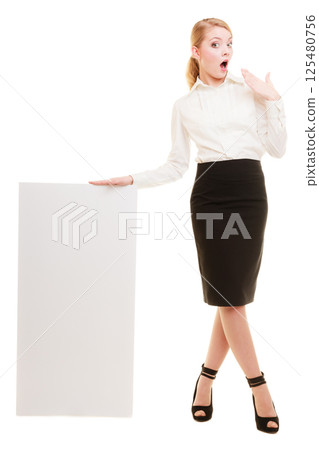 Ad. Businesswoman holding blank copy space banner Ad. Businesswoman holding blank copy space banner 125480756
