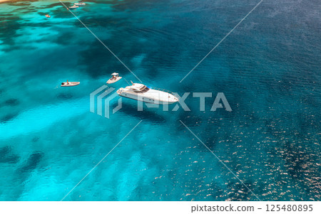Aerial view of luxury yacht and boat in blue sea in summer 125480895