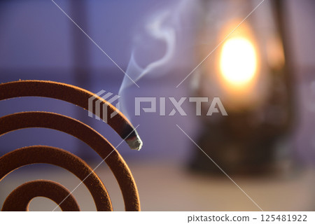 Mosquito coils and lantern lights 125481922