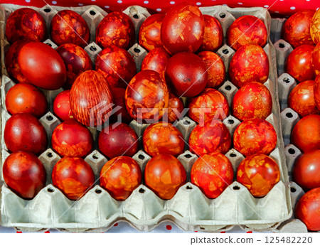 Red coloured Easter eggs on market 125482220