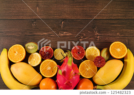 Flyer with tropical exotic fruits, summer vacation and healthy lifestyle concept. Advertising card for a market or store with space for text. Healthy vegan food for weight loss. Flyer with tropical exotic fruits, summer vacation and healthy lifestyle concept. Advertising card for a market or store with space for text. Healthy vegan food for weight loss. 125482323