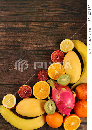 Flyer with tropical exotic fruits, summer vacation and healthy lifestyle concept. Advertising card for a market or store with space for text. Healthy vegan food for weight loss. Flyer with tropical exotic fruits, summer vacation and healthy lifestyle concept. Advertising card for a market or store with space for text. Healthy vegan food for weight loss. 125482325