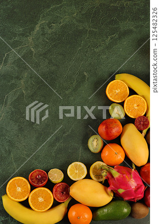 Flyer with tropical exotic fruits, summer vacation and healthy lifestyle concept. Advertising card for a market or store with space for text. Healthy vegan food for weight loss. 125482326