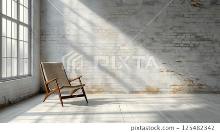 Chair is sitting in a room with a brick wall. The chair is brown and has a wooden back Chair is sitting in a room with a brick wall. The chair is brown and has a wooden back 125482342