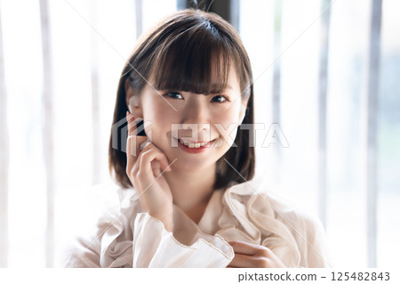 A young woman listening to music A young woman listening to music 125482843