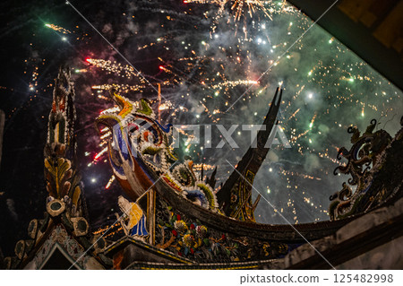 Night curtain hanging, smoke and flowers shining on ancient temples 125482998