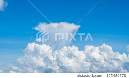 A majestic sea of clouds and cumulonimbus clouds floating in the blue sky A majestic sea of clouds and cumulonimbus clouds floating in the blue sky 125484578