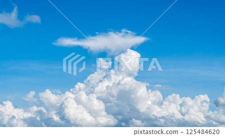 A majestic sea of clouds and cumulonimbus clouds floating in the blue sky A majestic sea of clouds and cumulonimbus clouds floating in the blue sky 125484620