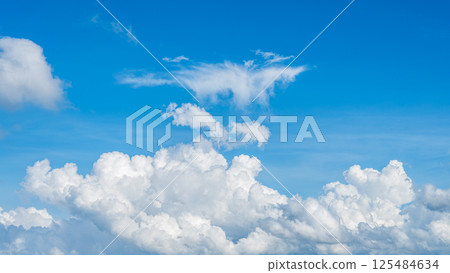 A majestic sea of clouds and cumulonimbus clouds floating in the blue sky A majestic sea of clouds and cumulonimbus clouds floating in the blue sky 125484634