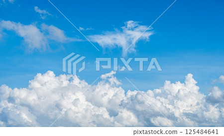 A majestic sea of clouds and cumulonimbus clouds floating in the blue sky A majestic sea of clouds and cumulonimbus clouds floating in the blue sky 125484641
