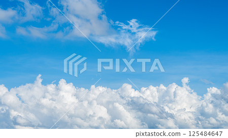 A majestic sea of clouds and cumulonimbus clouds floating in the blue sky A majestic sea of clouds and cumulonimbus clouds floating in the blue sky 125484647