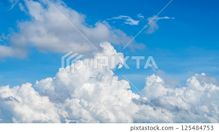 A majestic sea of clouds and cumulonimbus clouds floating in the blue sky A majestic sea of clouds and cumulonimbus clouds floating in the blue sky 125484753