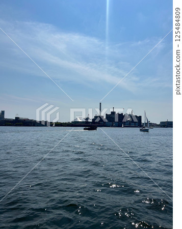Baltimore, MD Waterfront View with Sailboats and Historic Buildings at Harbor 125484809
