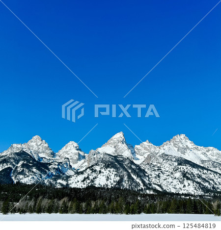 Snowy Peaks Under Blue Sky in Grand Teton National Park, Wyoming Snowy Peaks Under Blue Sky in Grand Teton National Park, Wyoming 125484819