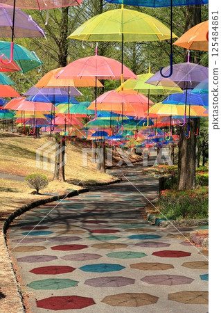 A sky umbrella that casts colorful shadows A sky umbrella that casts colorful shadows 125484861