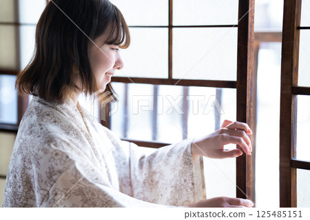 A young woman in a yukata A young woman in a yukata 125485151