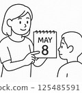 一位女士正在閱讀日曆上的日期（插圖） 125485591