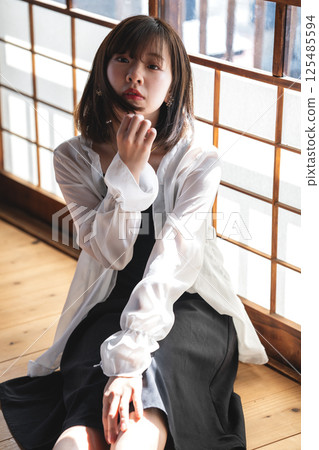 A cool young woman relaxing in a Japanese-style room A cool young woman relaxing in a Japanese-style room 125485594