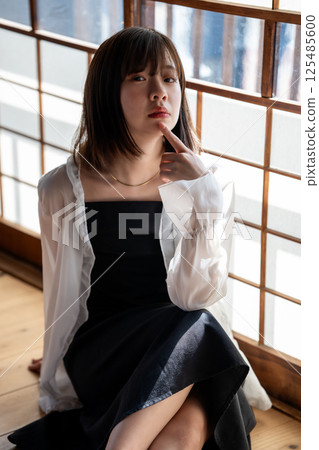 A cool young woman relaxing in a Japanese-style room A cool young woman relaxing in a Japanese-style room 125485600