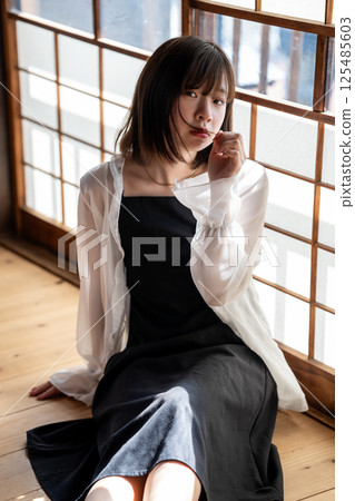 A cool young woman relaxing in a Japanese-style room A cool young woman relaxing in a Japanese-style room 125485603