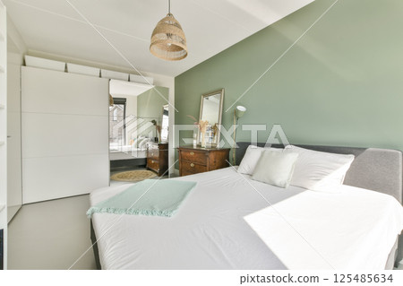 A stylish and contemporary interior showcasing unique furniture pieces and elegant decor, creating a harmonious living space that balances comfort and aesthetics. 125485634