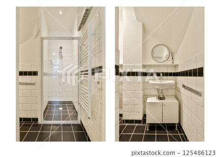 Clean lines and a sleek arrangement characterize this modern bathroom, featuring a shower and sink perfectly integrated into the space. 125486123