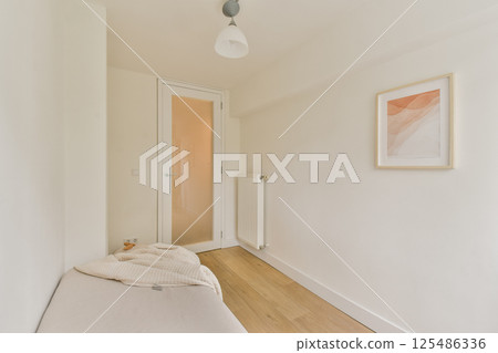 A serene and minimalist interior space featuring soft colors and simple decor. The design emphasizes clean lines and a calming atmosphere. 125486336