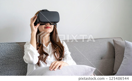 AI image: A woman enjoying virtual reality in her living room using a head-mounted display 125486544