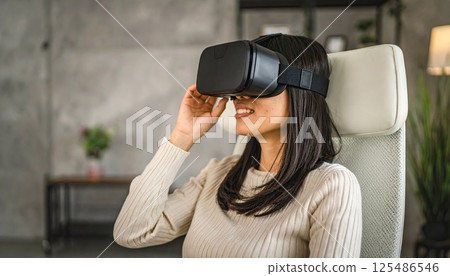 AI image: A woman enjoying virtual reality in her living room using a head-mounted display 125486546